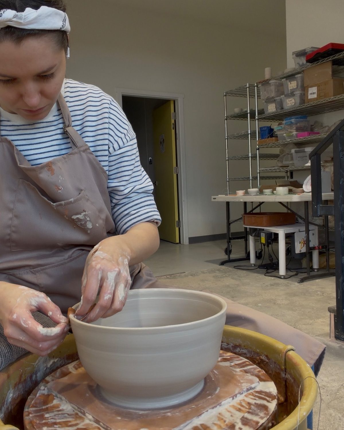 Alona working on the pottery wheel